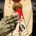 Drac's hand and bloody handkerchief