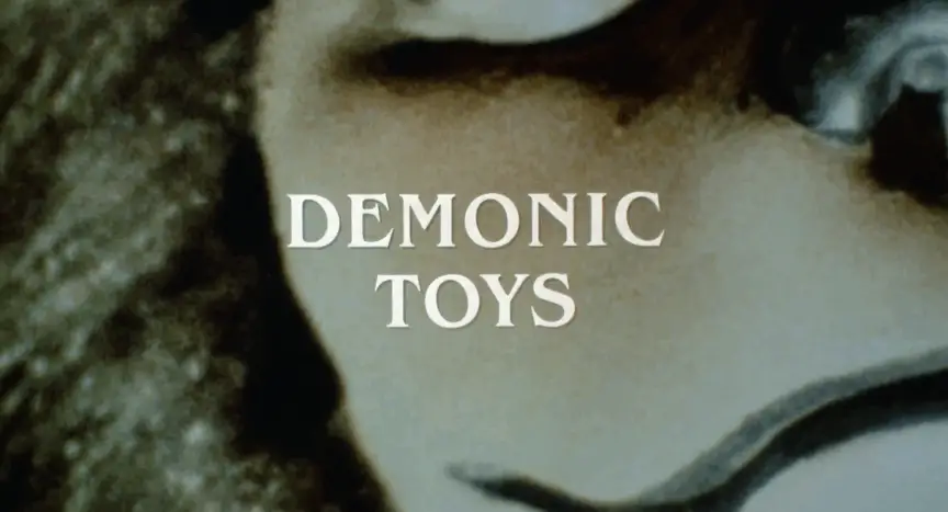 1992's Demonic Toys was written by the same guy who wrote 2008's The Dark Knight ... no really.